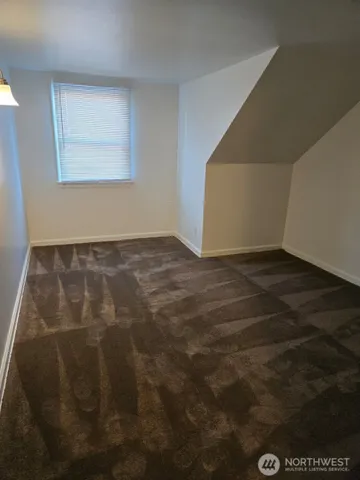 a view of an empty room with windows