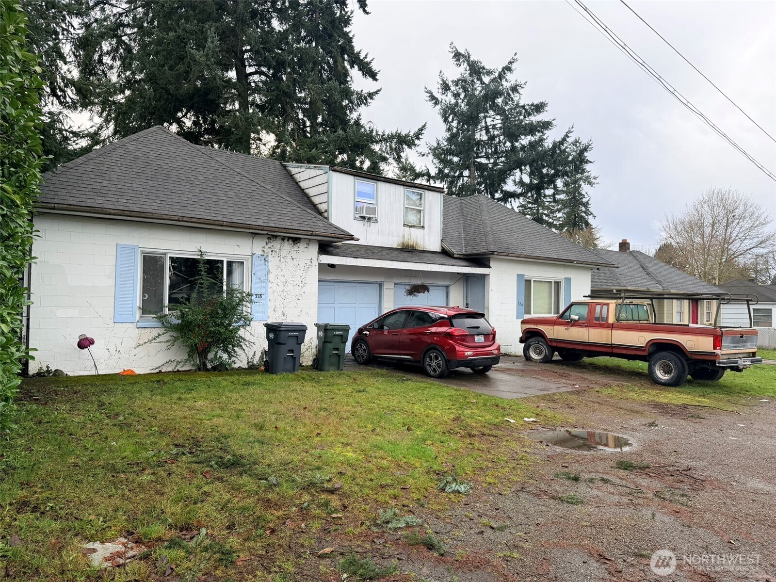 224 116th Street South Tacoma, WA 98444 - Photo 3 of 26 a view of a house with a cars park side of a road