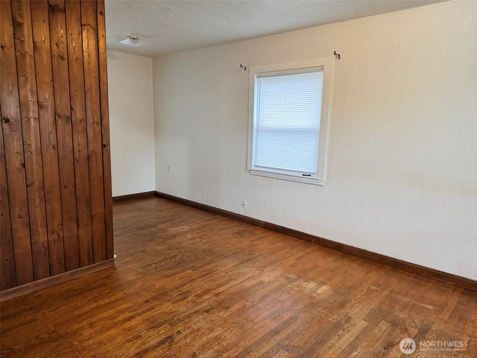 224 116th Street South Tacoma, WA 98444 - Photo 8 of 26 an empty room with wooden floor and windows