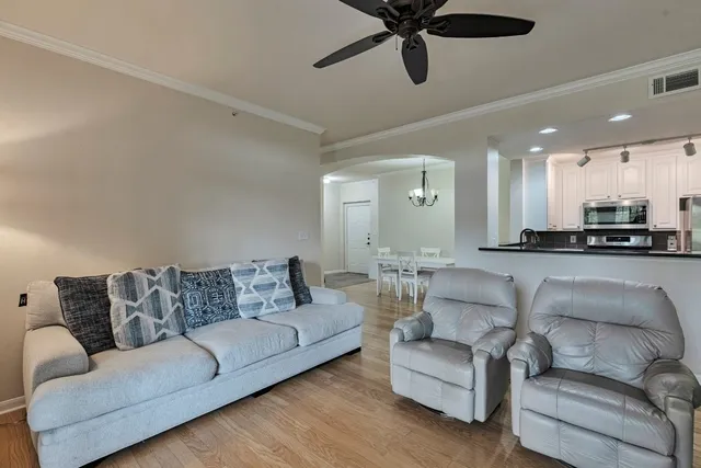 a bedroom with a bed and ceiling fan