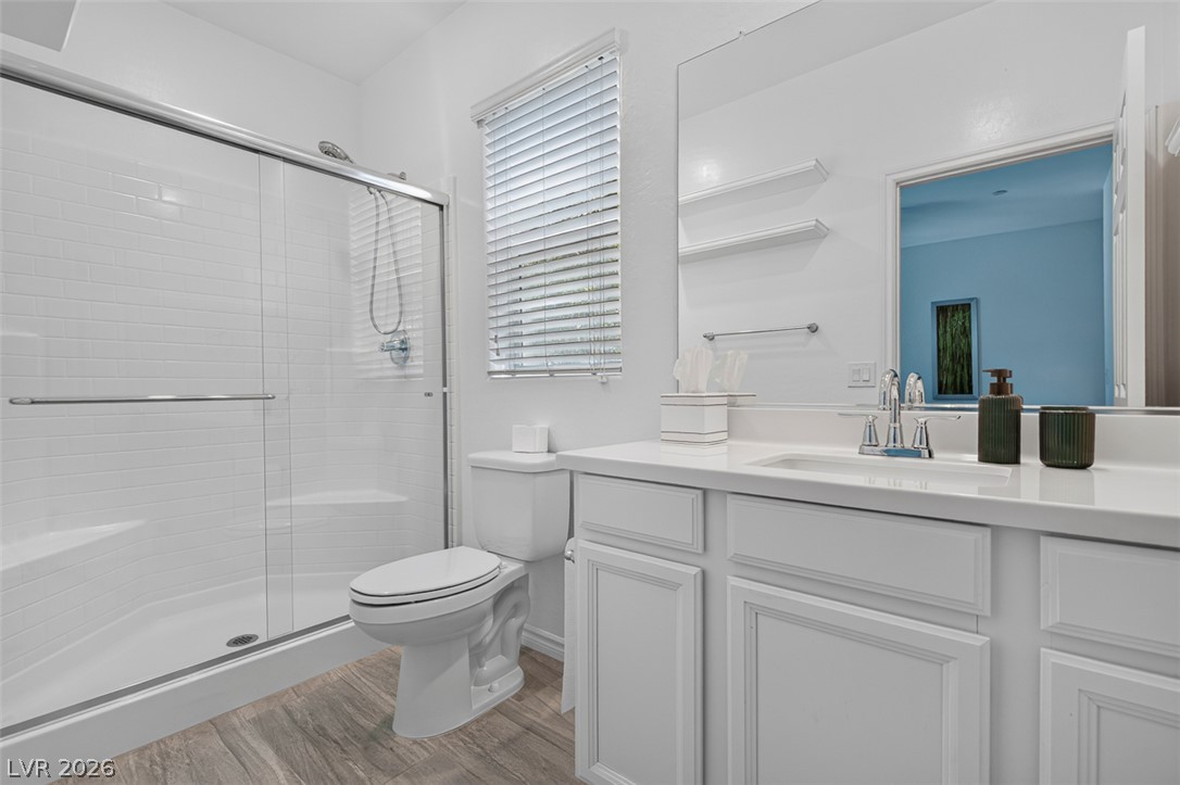 1824 Redland Ridge Street Henderson, NV 89002 - Photo 28 of 69 A streamlined modern bathroom with a spacious walk-in shower and elegant vanity.