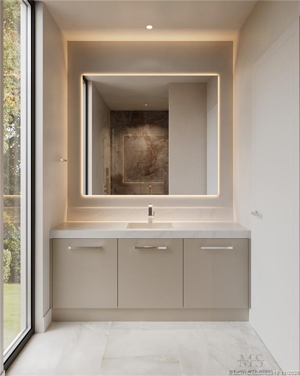 2421 Bahia Way Stuart, FL 34996 - Photo 21 of 63 a bathroom with a sink and a mirror