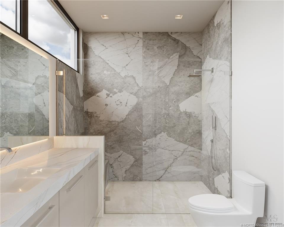 2421 Bahia Way Stuart, FL 34996 - Photo 30 of 63 a bathroom with a granite countertop shower a toilet and sink