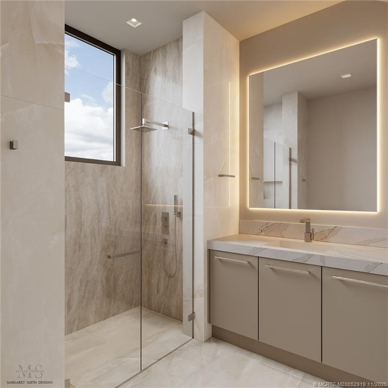 2421 Bahia Way Stuart, FL 34996 - Photo 31 of 63 a bathroom with a shower sink and mirror