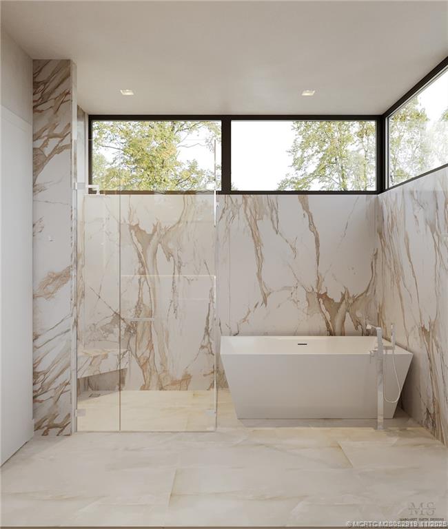 2421 Bahia Way Stuart, FL 34996 - Photo 32 of 63 a bathroom with a bathtub and window