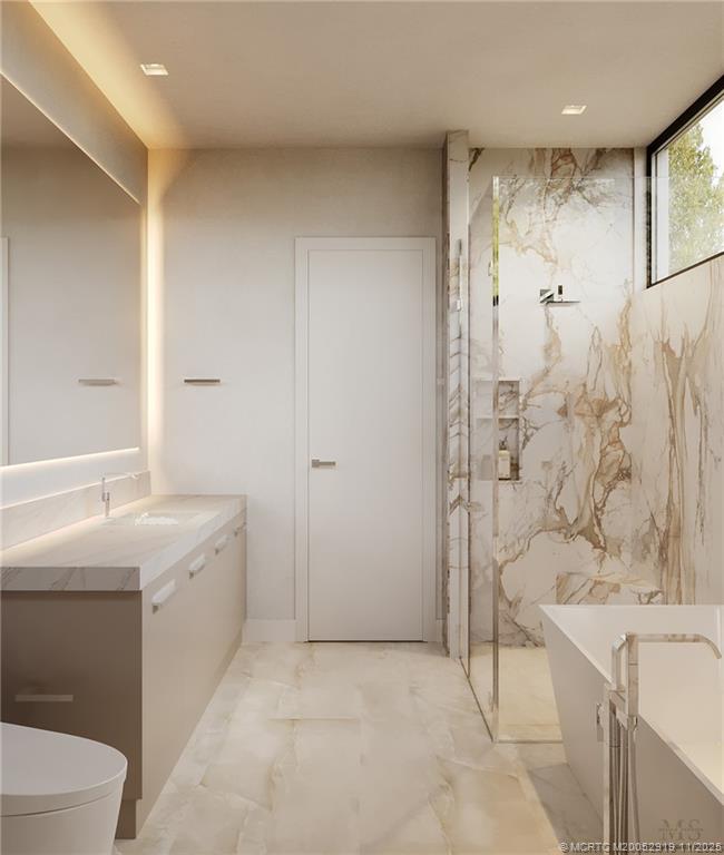 2421 Bahia Way Stuart, FL 34996 - Photo 33 of 63 a bathroom with a bathtub and a sink