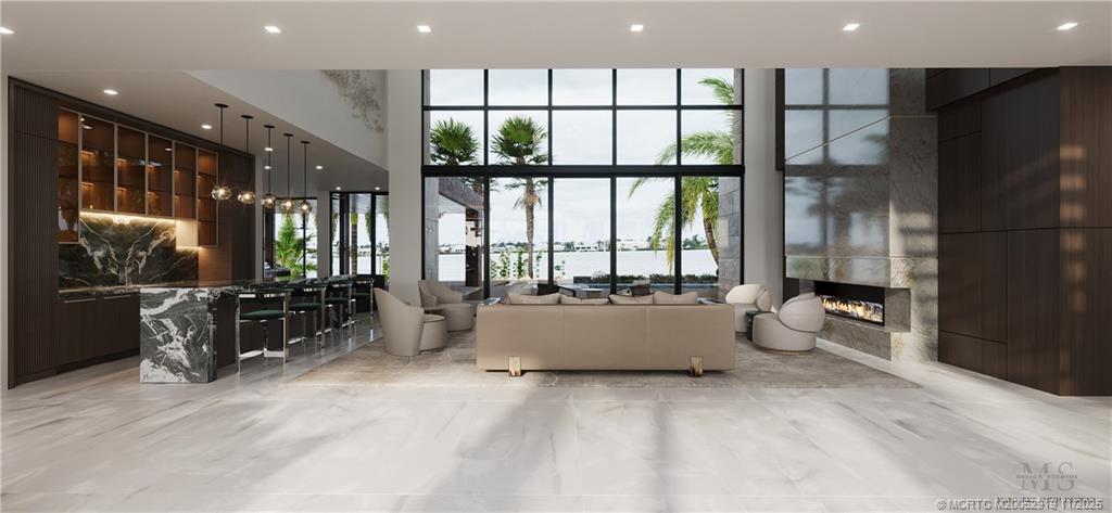 2421 Bahia Way Stuart, FL 34996 - Photo 10 of 63 a living room with furniture and large windows