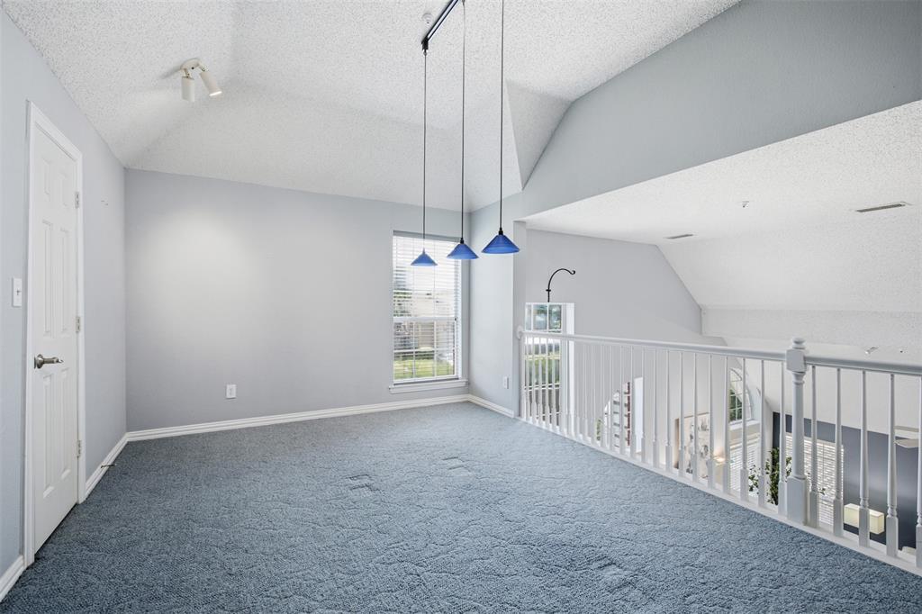 14584 Blueberry Court Addison, TX 75001 - Photo 26 of 40 a view of a room with staircase and white walls