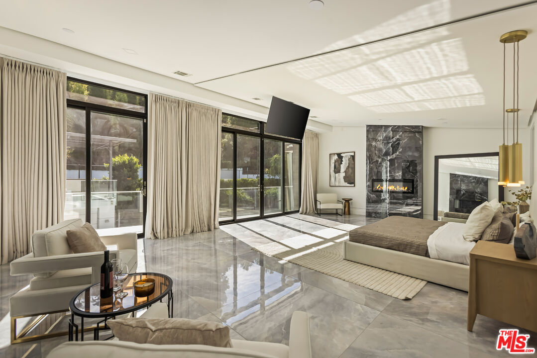 4230 Valley Meadow Road Encino, CA 91436 - Photo 17 of 44 a living room with furniture and a large window