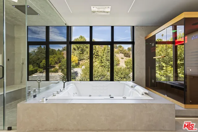 a bath tub sitting in front of a window