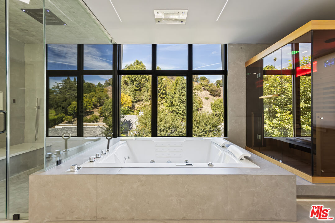 4230 Valley Meadow Road Encino, CA 91436 - Photo 20 of 44 a bath tub sitting in front of a window