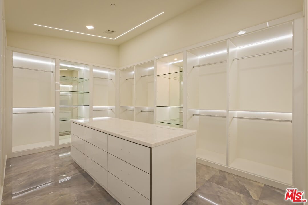 4230 Valley Meadow Road Encino, CA 91436 - Photo 22 of 44 a bathroom with a sink and mirror