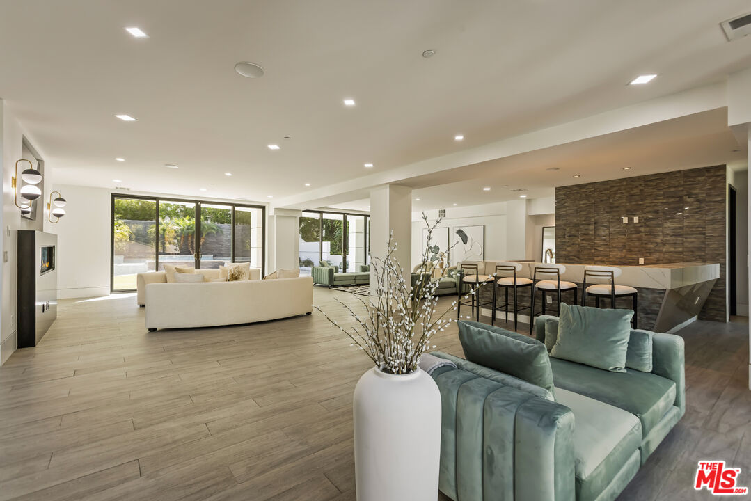 4230 Valley Meadow Road Encino, CA 91436 - Photo 26 of 44 a living room with furniture and a table
