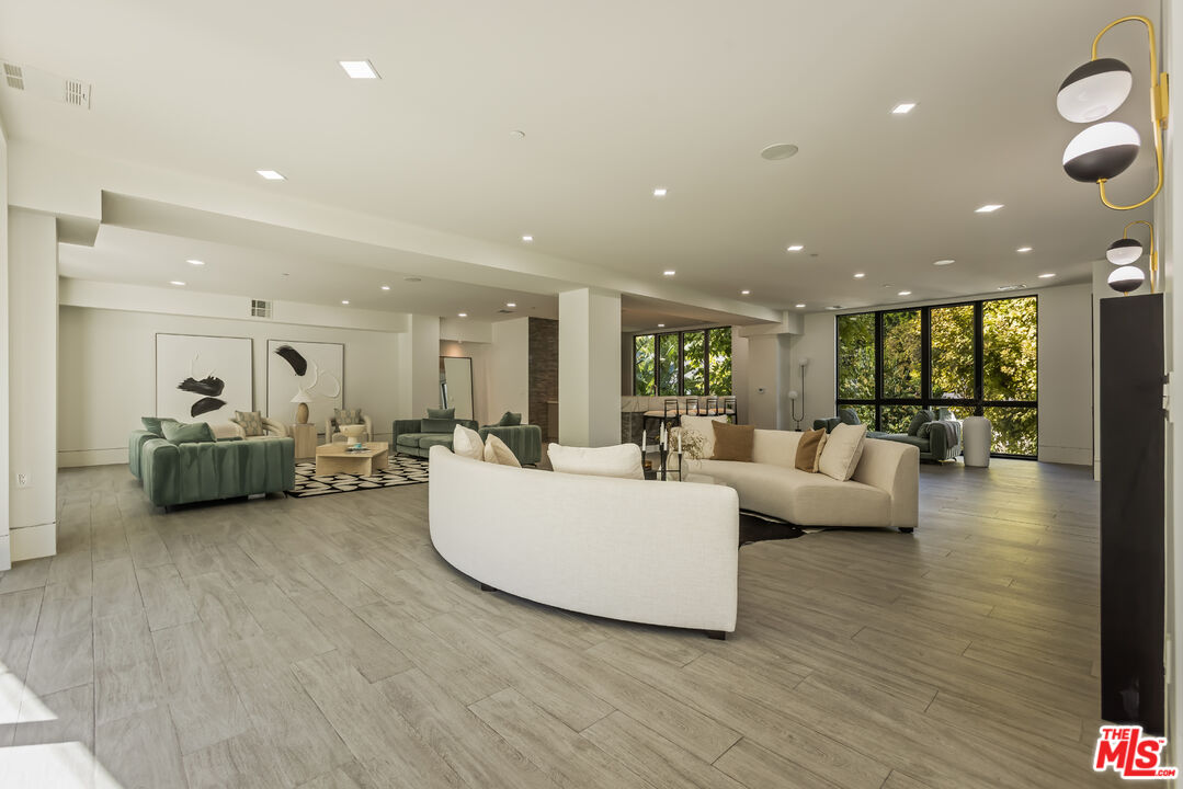 4230 Valley Meadow Road Encino, CA 91436 - Photo 28 of 44 a living room with furniture and a large window