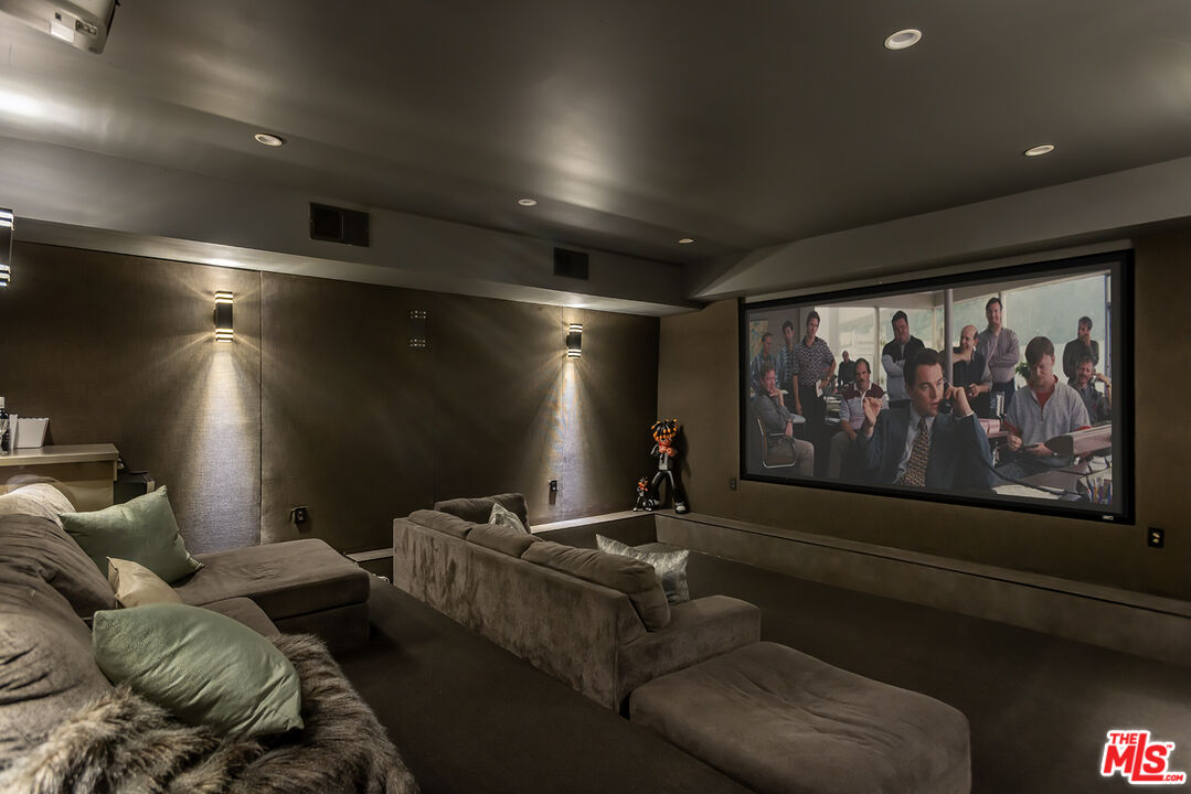 4230 Valley Meadow Road Encino, CA 91436 - Photo 31 of 44 a media room with furniture and screen