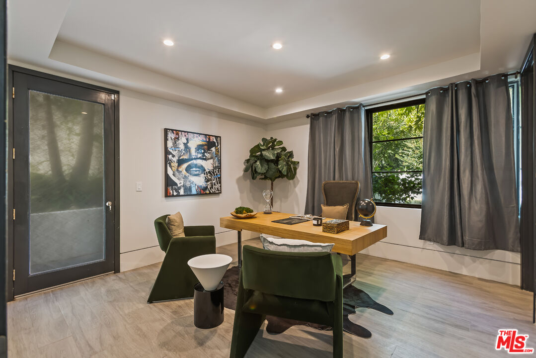 4230 Valley Meadow Road Encino, CA 91436 - Photo 33 of 44 a dining room with furniture and window