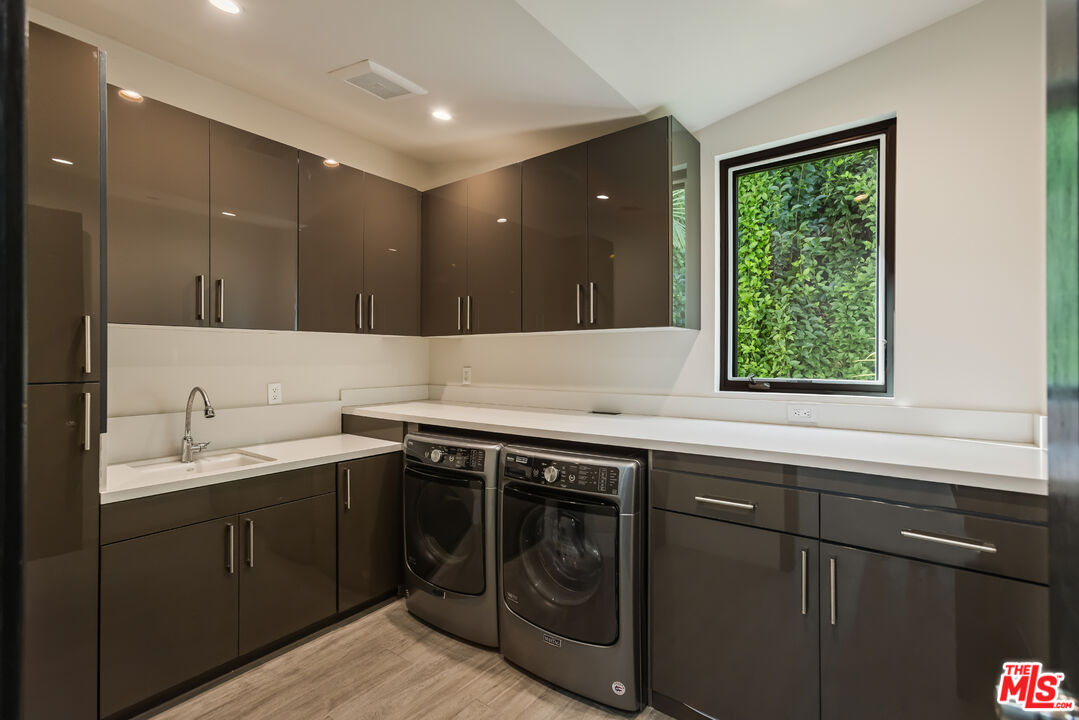 4230 Valley Meadow Road Encino, CA 91436 - Photo 37 of 44 a kitchen with a sink and a window