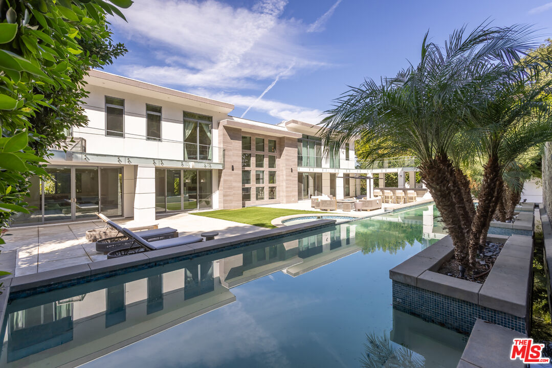 4230 Valley Meadow Road Encino, CA 91436 - Photo 41 of 44 a front view of house with yard slide and outdoor seating