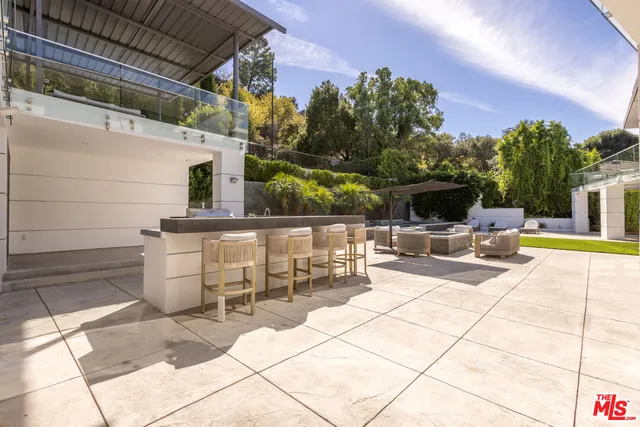 a view of a swimming pool with sitting area