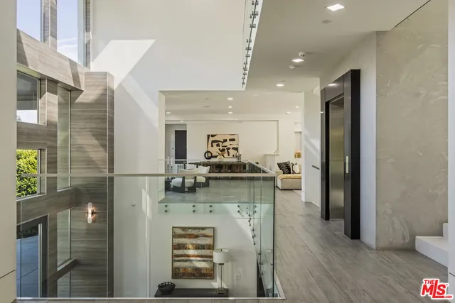 a kitchen with stainless steel appliances kitchen island granite countertop a refrigerator and a stove