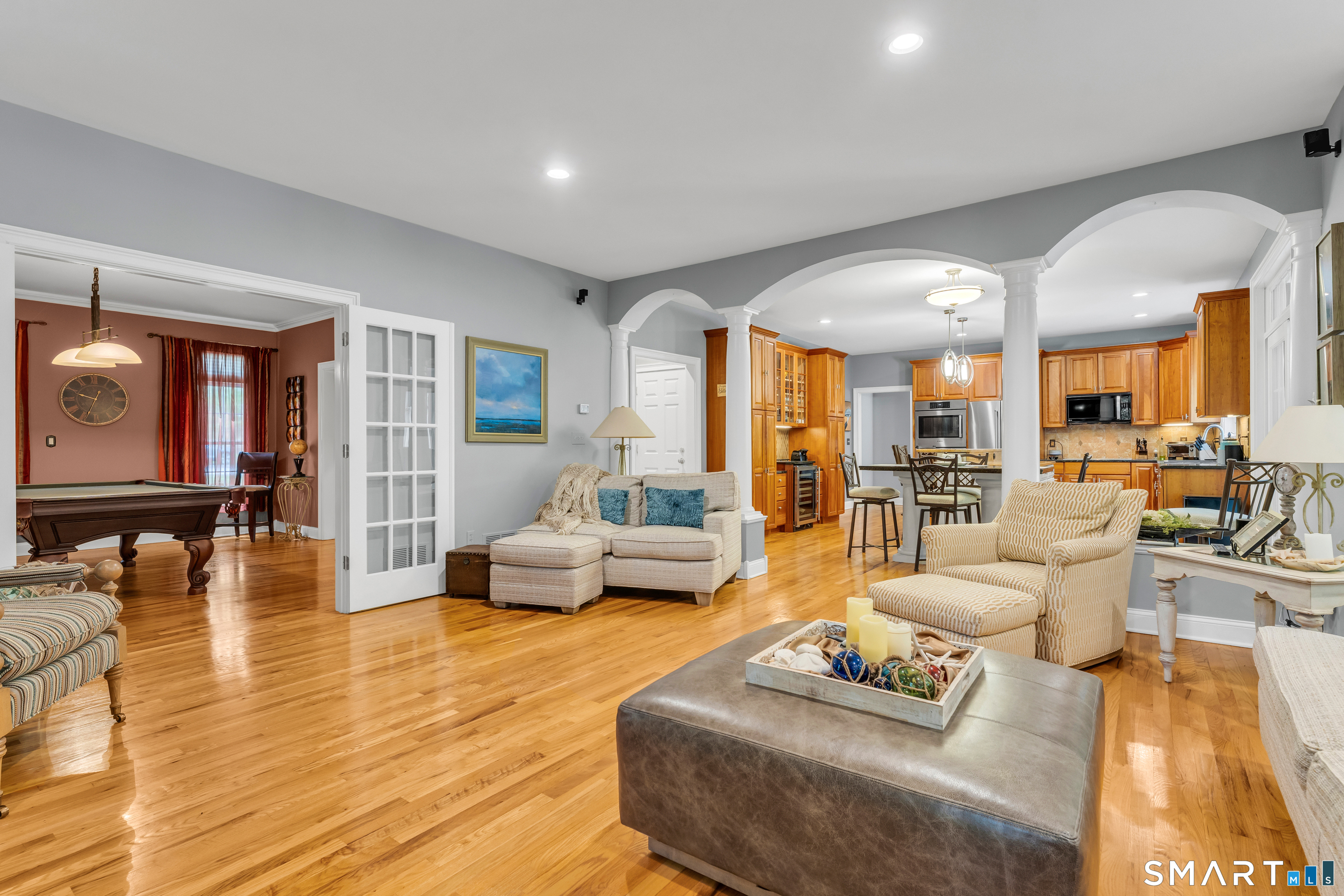 11 Timber Lane Guilford, CT 06437 - Photo 6 of 39 Family room with arched entry from kitchen set to be easily enjoyed