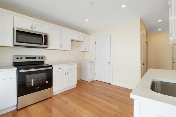 a kitchen with a stove and a microwave