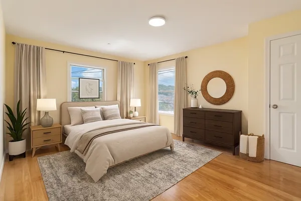 a bedroom with a bed and a dresser