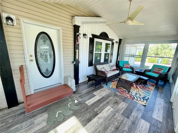 a kitchen with a dining table chairs stainless steel appliances and cabinets