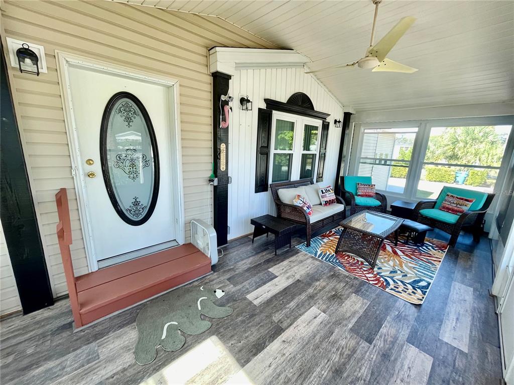 6333 Bear Trail Weeki Wachee, FL 34607 - Photo 13 of 52 a living room with furniture a window a rug and a floor to ceiling window