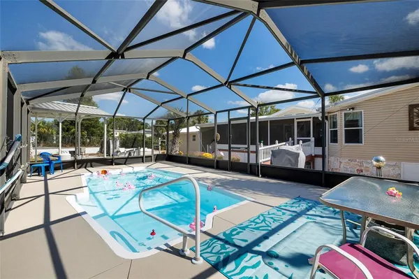 a view of a swimming pool with a patio