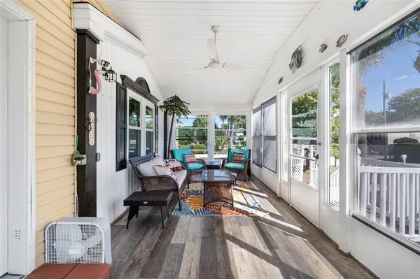 a living room with lots of furniture and kitchen view