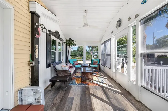 a living room with lots of furniture and kitchen view