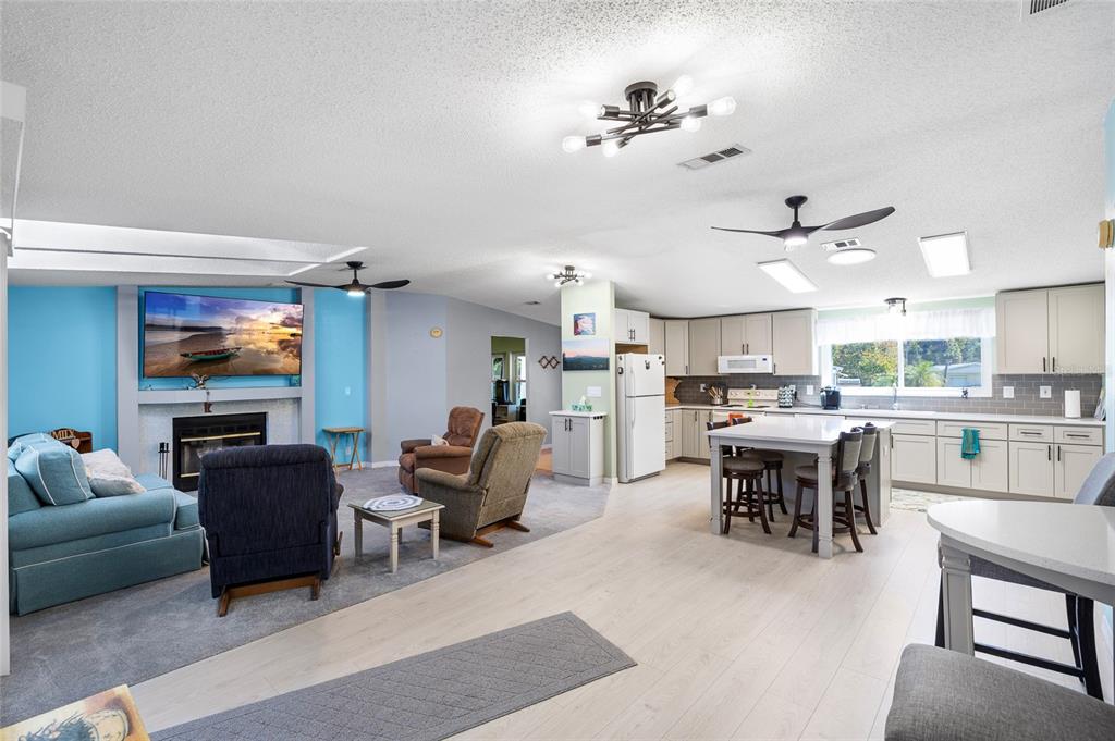 6333 Bear Trail Weeki Wachee, FL 34607 - Photo 22 of 52 a living room with lots of furniture and kitchen view