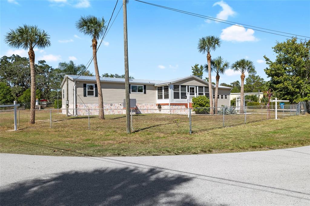 6333 Bear Trail Weeki Wachee, FL 34607 - Photo 23 of 52 a front view of a house with garden
