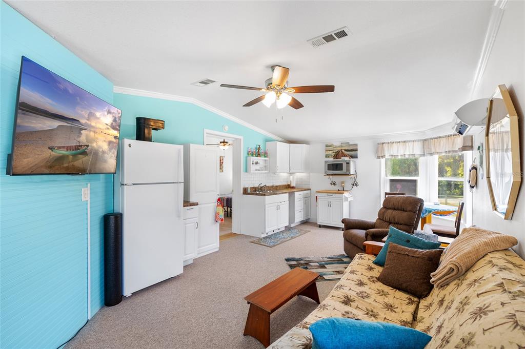 6333 Bear Trail Weeki Wachee, FL 34607 - Photo 26 of 52 a living room with furniture and a flat screen tv