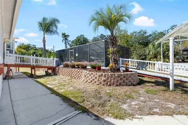 a living room with furniture a clock and a window