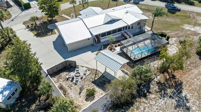 a kitchen with stainless steel appliances white cabinets and a stove top oven