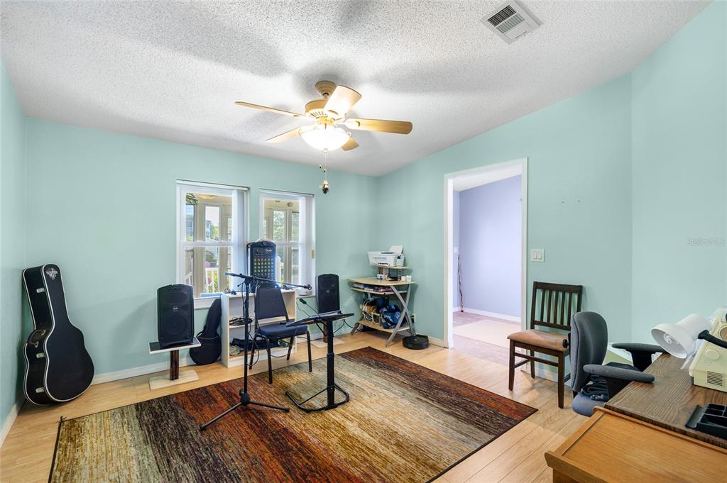 6333 Bear Trail Weeki Wachee, FL 34607 - Photo 34 of 52 a living room with furniture and a wooden floor