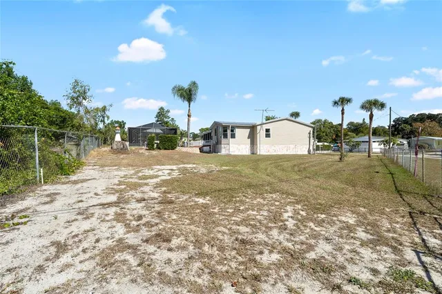 a view of backyard with green space