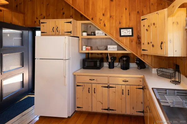a kitchen with a sink and a refrigerator