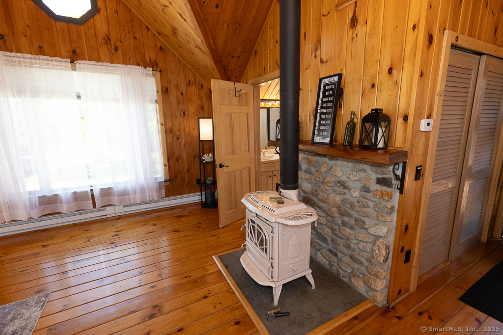 48 Swan Avenue, Unit A Old Lyme, CT 06371 - Photo 16 of 22 a bathroom with a toilet sink and mirror