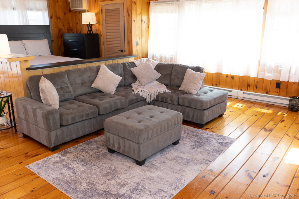 48 Swan Avenue, Unit A Old Lyme, CT 06371 - Photo 17 of 22 a living room with furniture and a couch