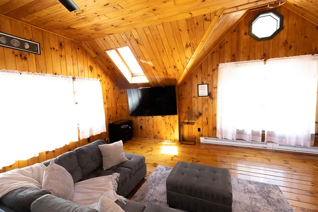 a living room with a couch and a flat screen tv