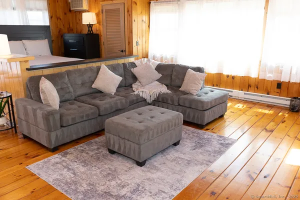 a living room with a couch and a flat screen tv