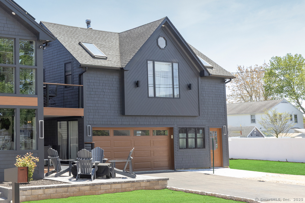 48 Swan Avenue, Unit A Old Lyme, CT 06371 - Photo 2 of 22 a front view of a house with garden