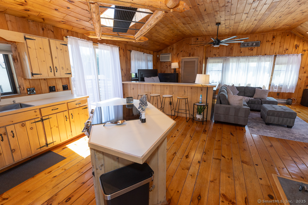 48 Swan Avenue, Unit A Old Lyme, CT 06371 - Photo 6 of 22 a living room with furniture and a large window
