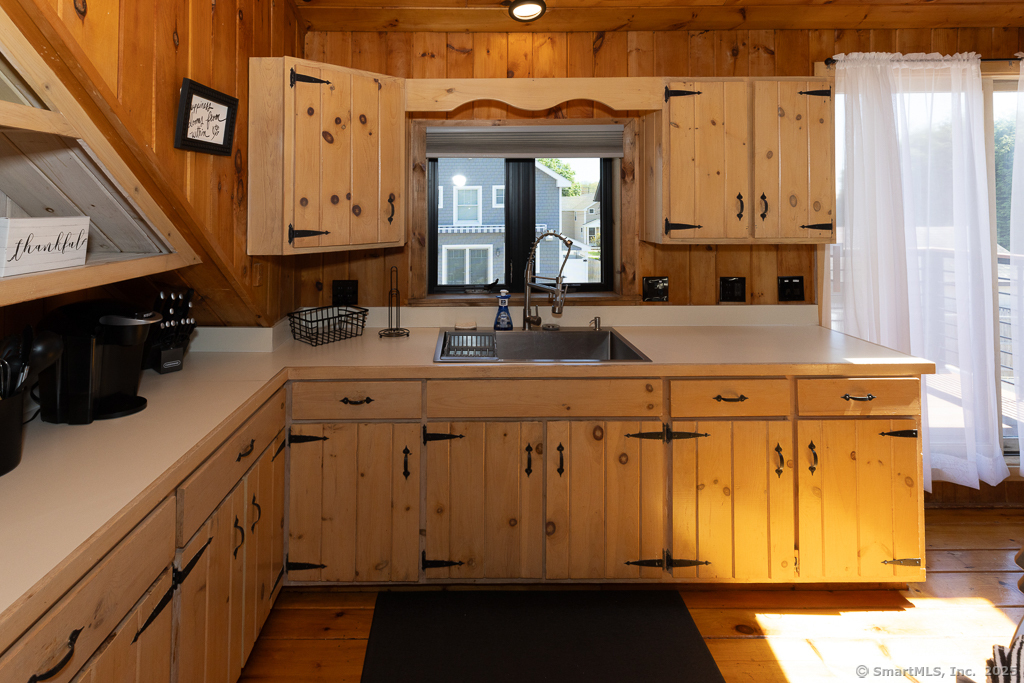 48 Swan Avenue, Unit A Old Lyme, CT 06371 - Photo 9 of 22 a kitchen with a sink and cabinets