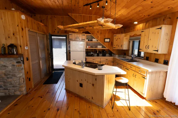 a kitchen with a sink and cabinets
