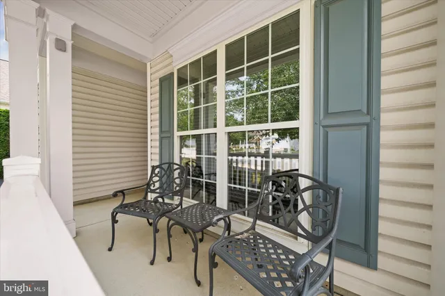 a view of a chair and table in the balcony