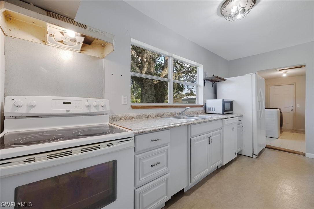 2701 Packinghouse Road Alva, FL 33920 - Photo 18 of 33 a kitchen with appliances cabinets and a sink